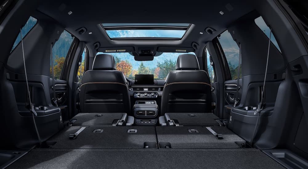 The black interior of a 2025 Honda Pilot Trailsport is shown after leaving a Honda dealer near Bloomingdale.