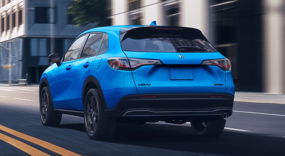 Blue 2026 Honda HR-V driving on a city street