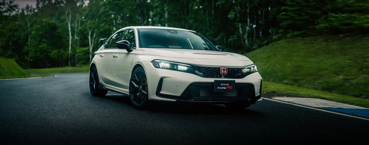 A white 2023 Honda Civic Type R racing.